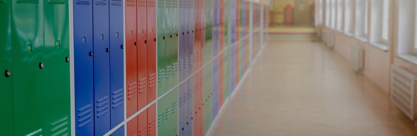 row of colorful lockers in a bright hallway